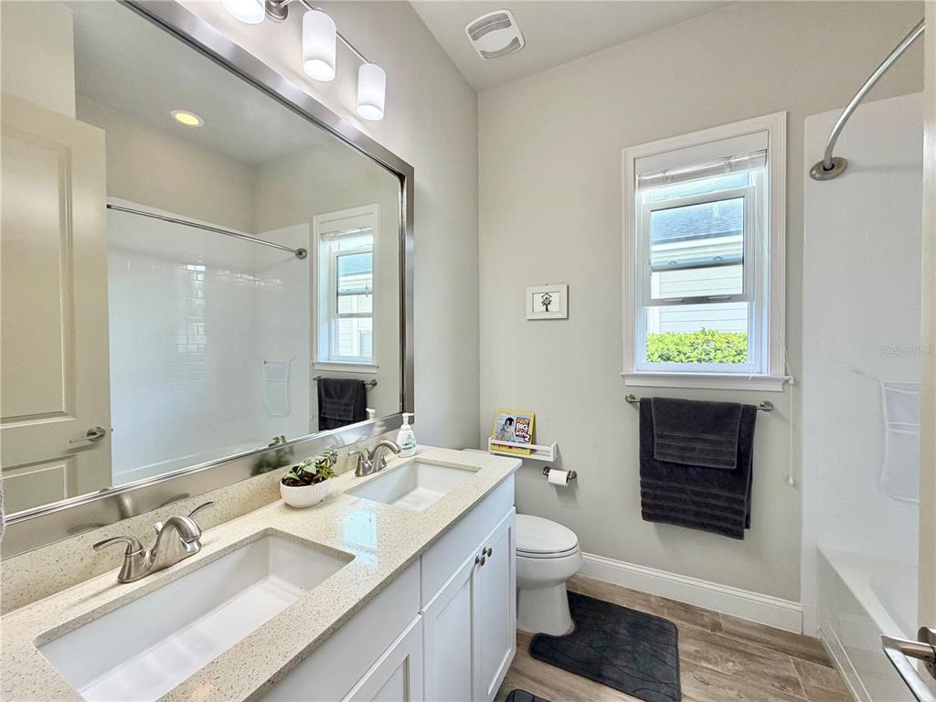 11931 Southwest 32nd Lane Gainesville, FL 32608 - Photo 31 of 78 a bathroom with a sink double vanity and a toilet