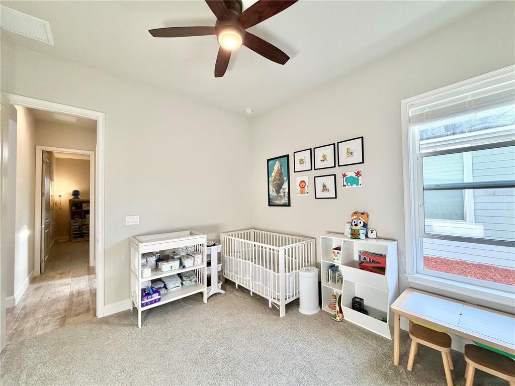 11931 Southwest 32nd Lane Gainesville, FL 32608 - Photo 33 of 78 a room with a bed and a window