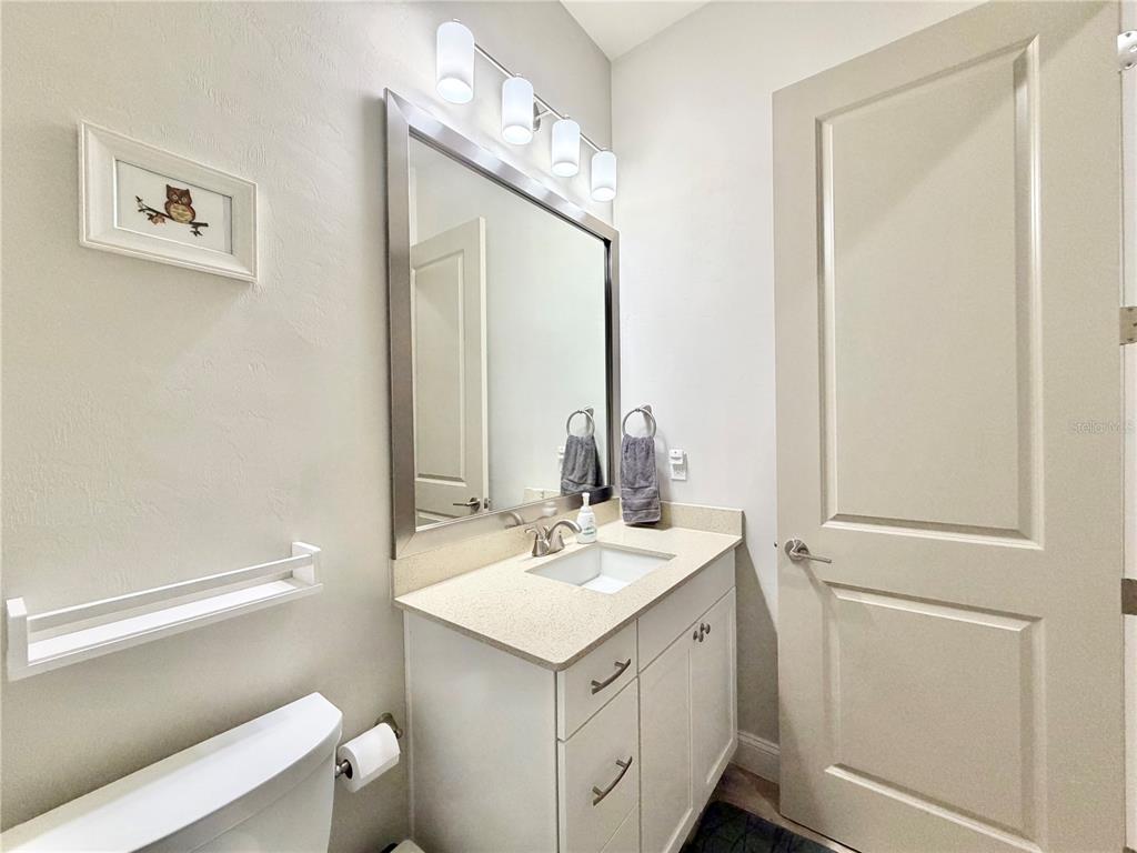 11931 Southwest 32nd Lane Gainesville, FL 32608 - Photo 36 of 78 a bathroom with a sink and a mirror