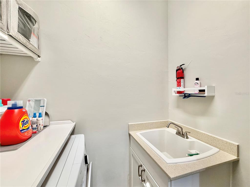 11931 Southwest 32nd Lane Gainesville, FL 32608 - Photo 42 of 78 a bathroom with a sink and a vanity