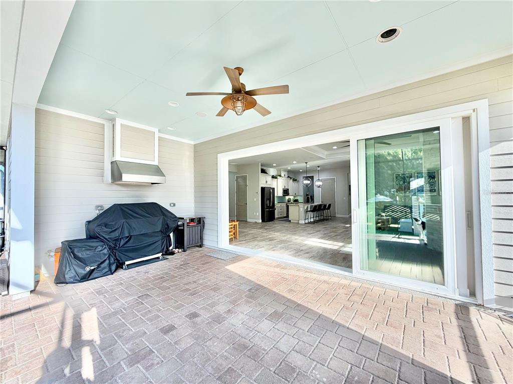 11931 Southwest 32nd Lane Gainesville, FL 32608 - Photo 46 of 78 a living room with furniture a ceiling fan and a window