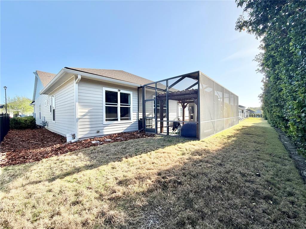 11931 Southwest 32nd Lane Gainesville, FL 32608 - Photo 53 of 78 a front view of a house with a yard and garage