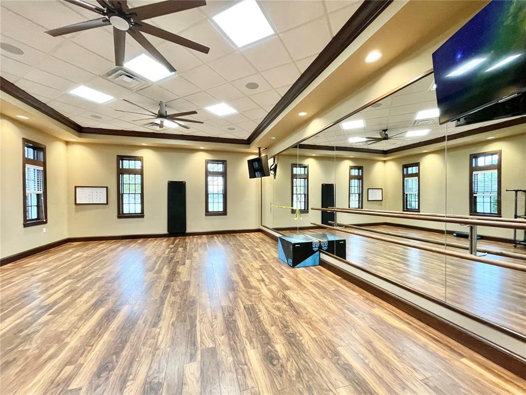 11931 Southwest 32nd Lane Gainesville, FL 32608 - Photo 66 of 78 a room with lots of wooden floor and lots of dining space