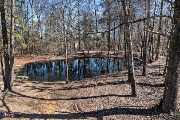 a bedroom with a bed a dresser and a book shelf
