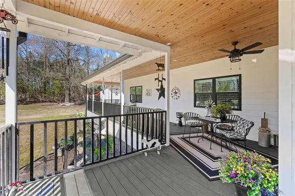 a view of balcony with furniture