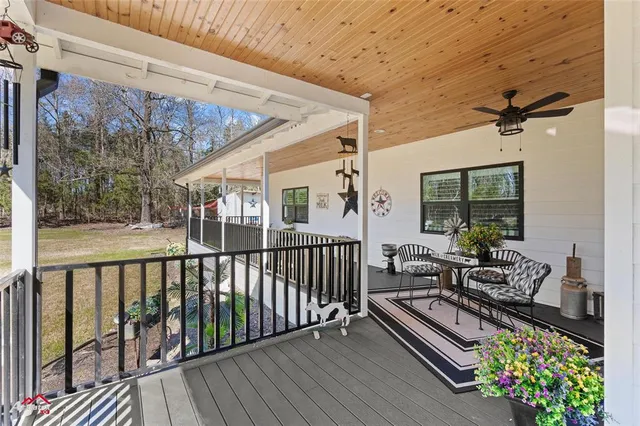 a view of balcony with furniture