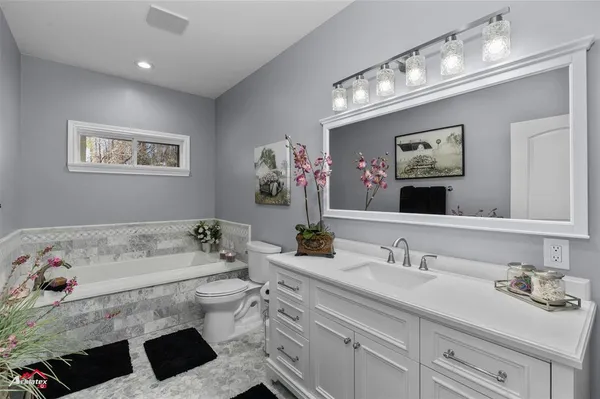 a utility room with sink dryer and washer