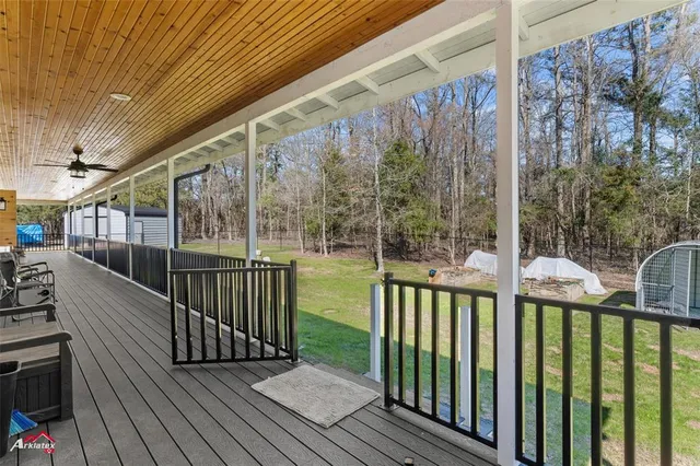 a view of a balcony with wooden floor