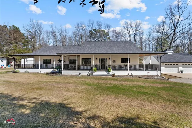 a view of a swimming pool and a yard