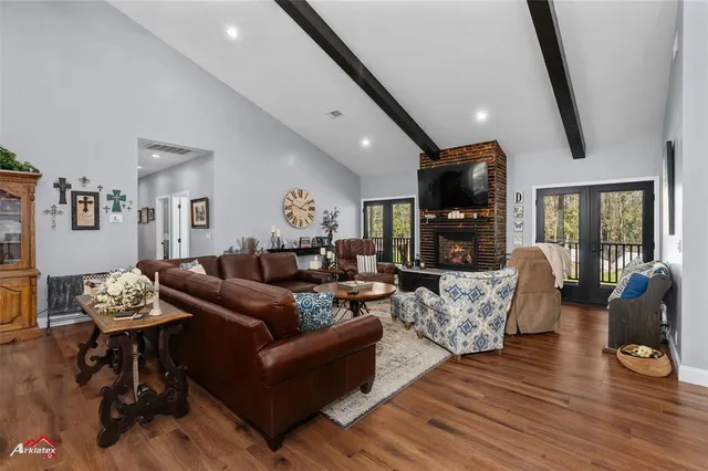 a living room with fireplace furniture and a flat screen tv