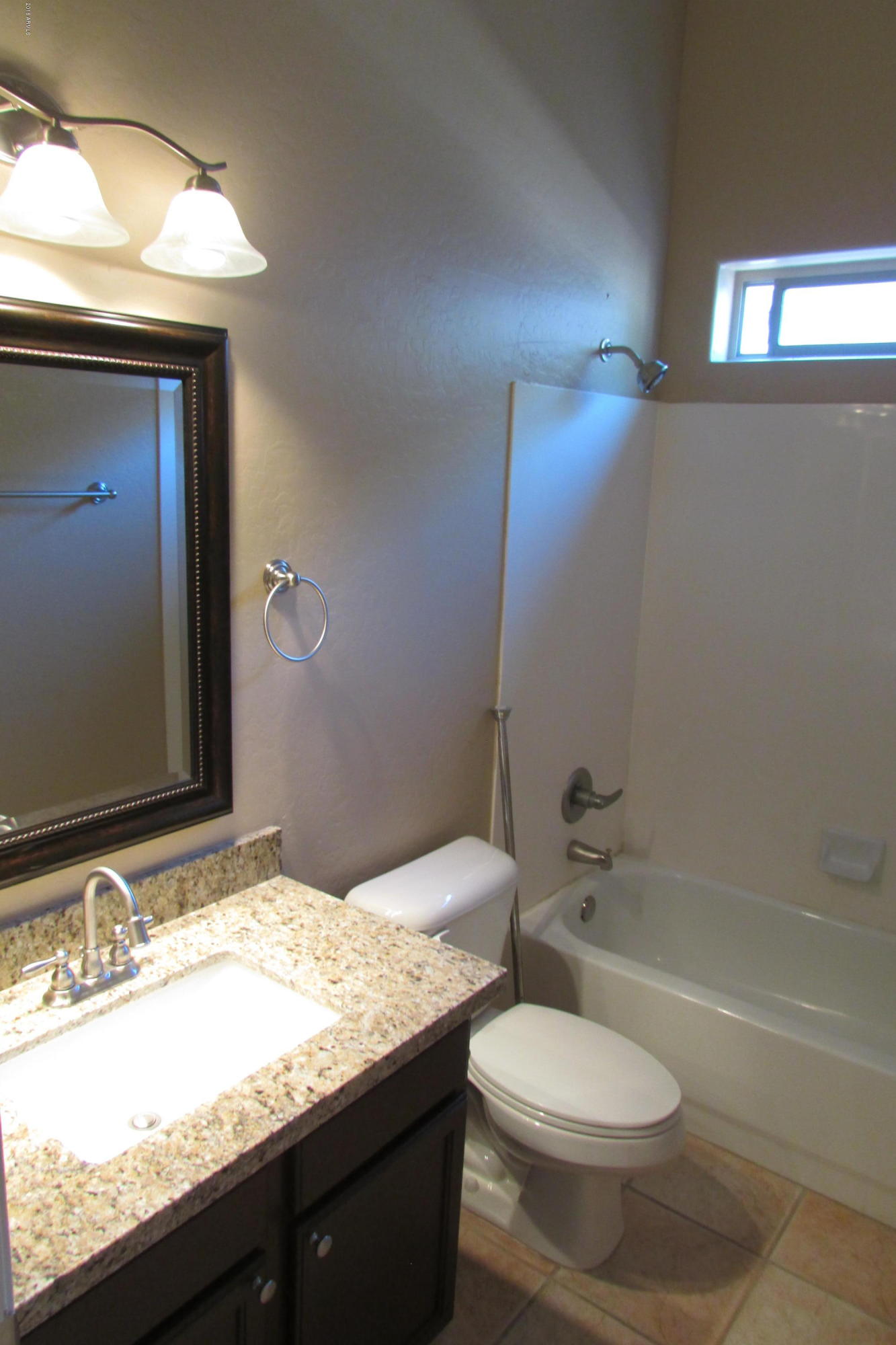 716 East Ranch Road Gilbert, AZ 85296 - Photo 11 of 22 a bathroom with a granite countertop sink toilet and shower