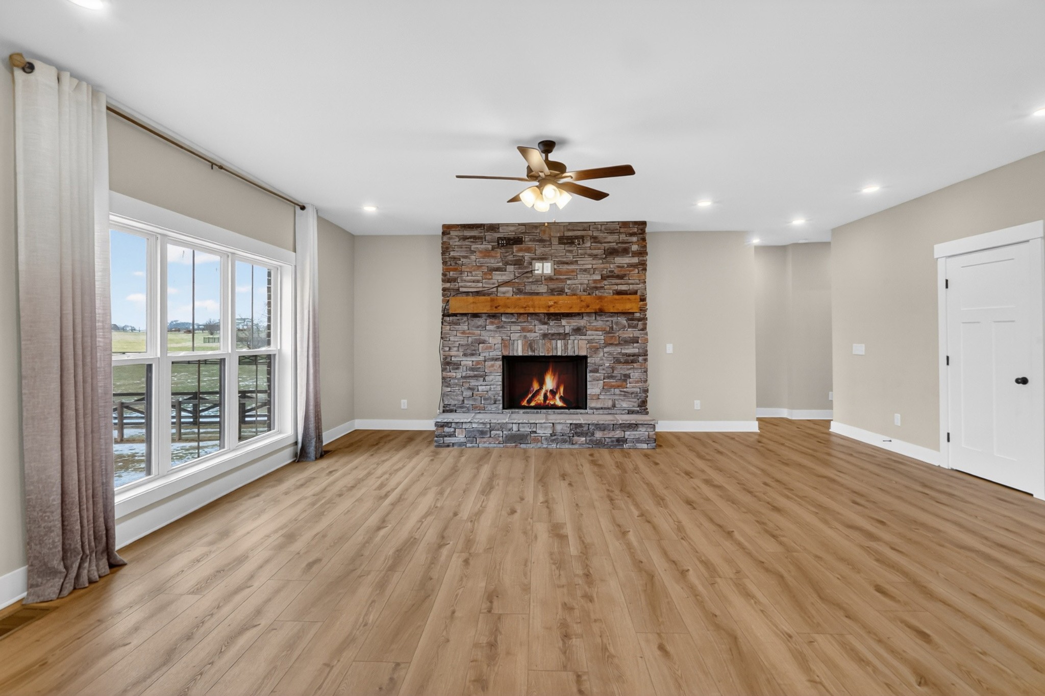 746 North Russell Street Portland, TN 37148 - Photo 11 of 45 a view of empty room with wooden floor and fireplace