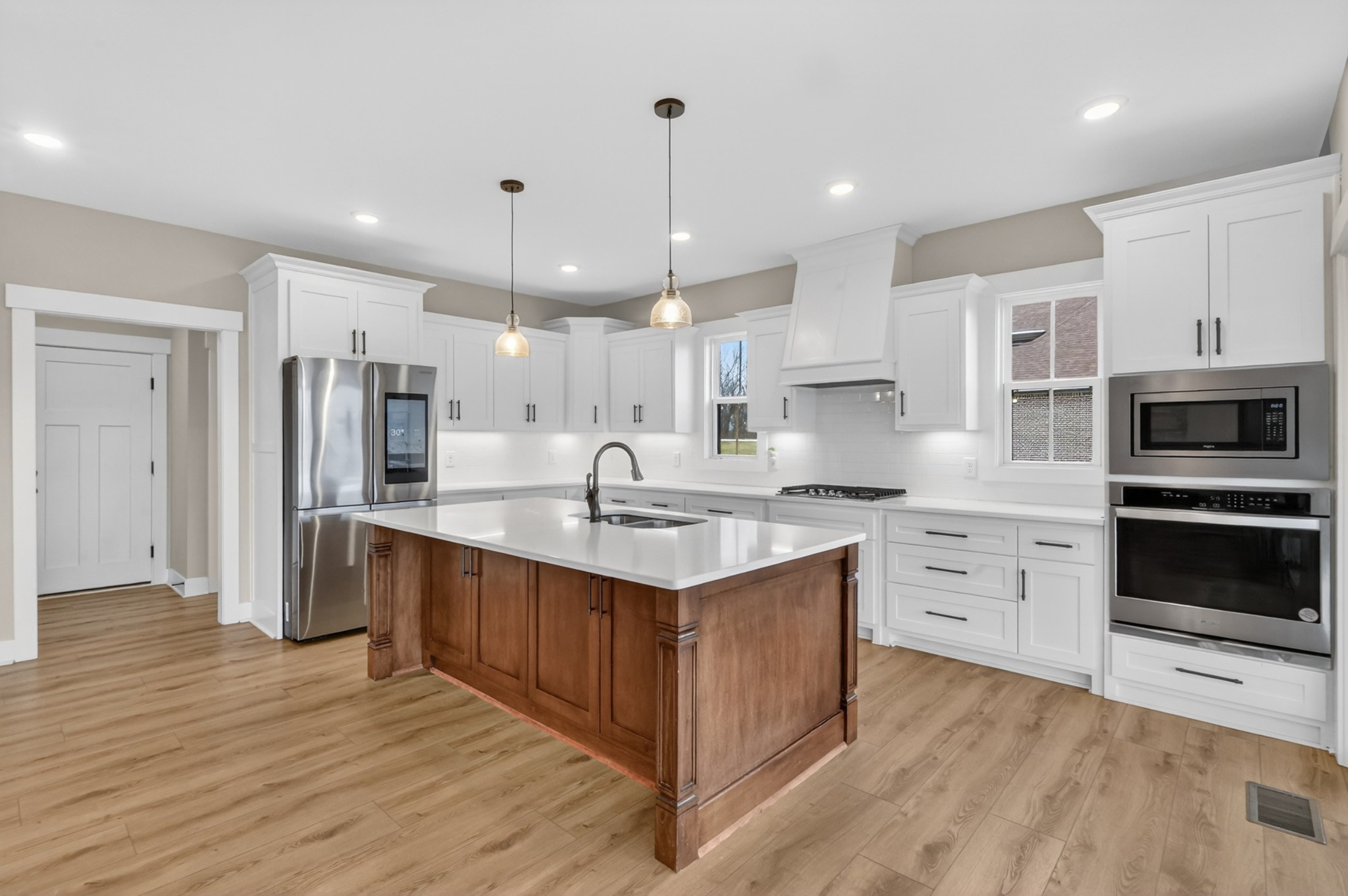 746 North Russell Street Portland, TN 37148 - Photo 12 of 45 a kitchen with stainless steel appliances granite countertop a sink stove and refrigerator