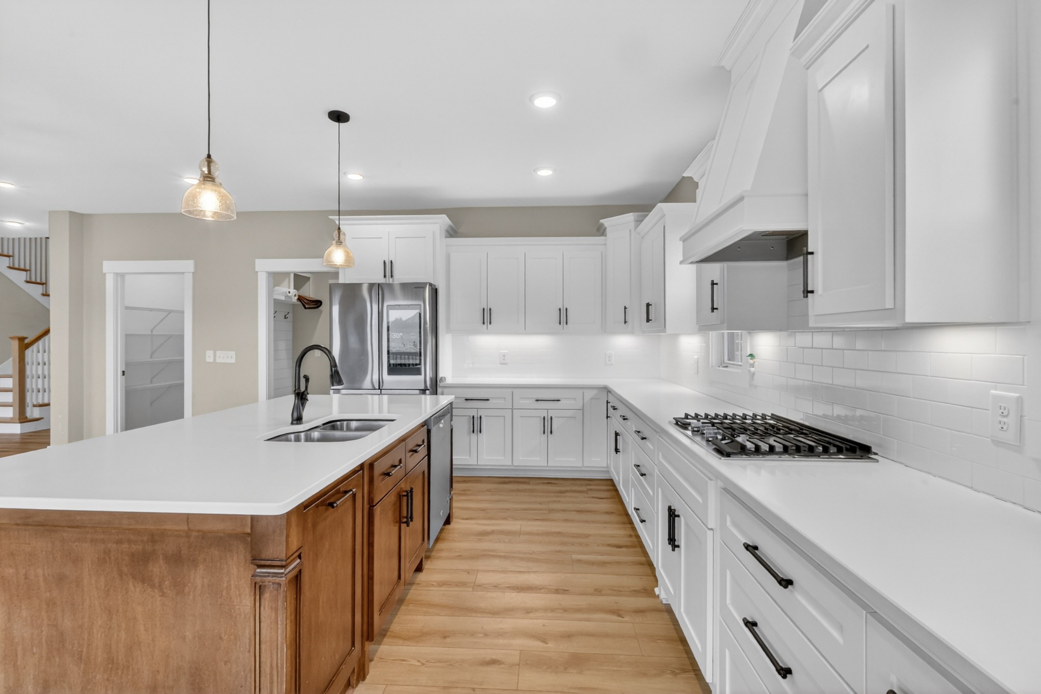 746 North Russell Street Portland, TN 37148 - Photo 14 of 45 a kitchen with kitchen island stainless steel appliances a sink a counter top stove and cabinets