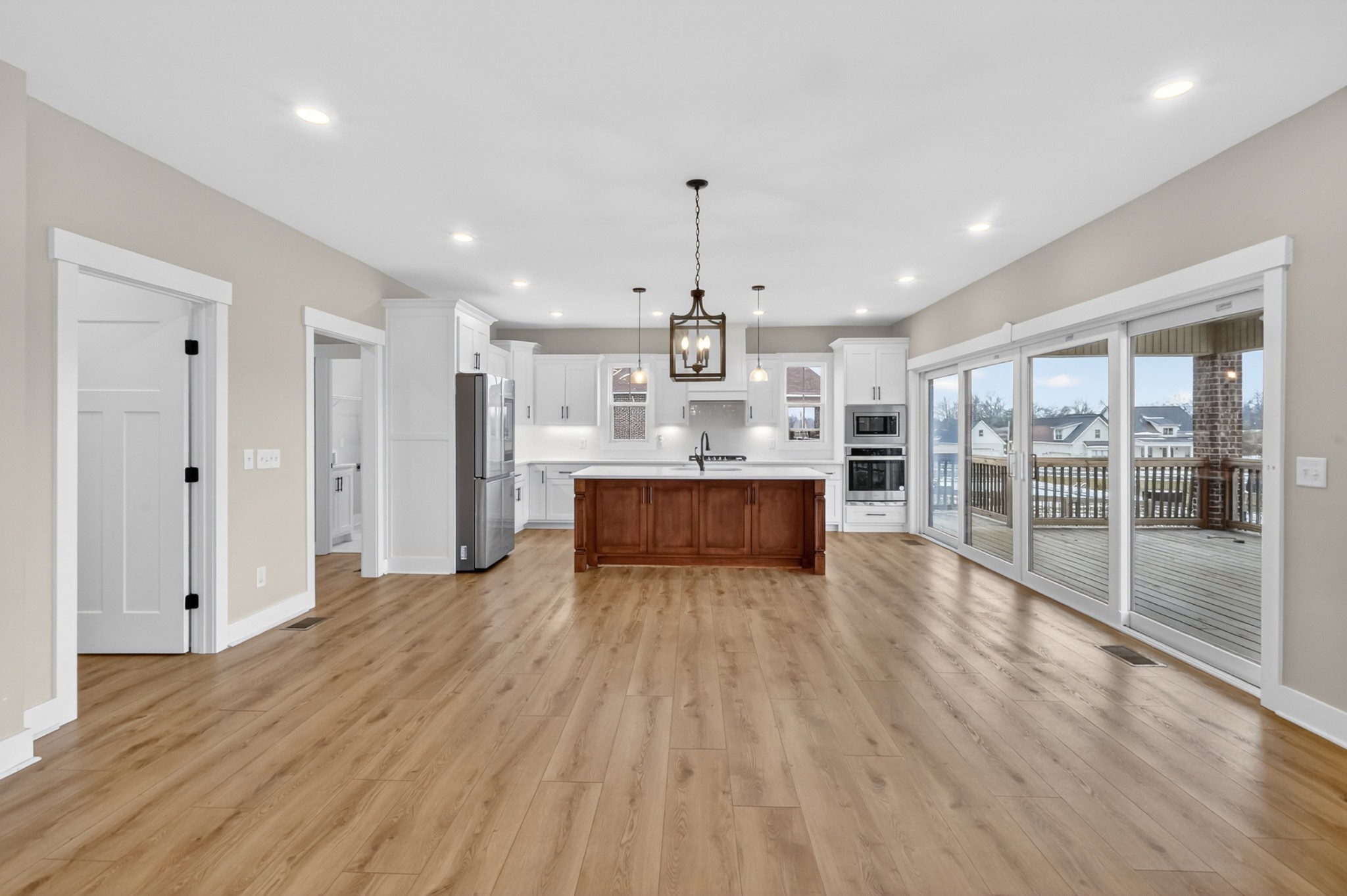 746 North Russell Street Portland, TN 37148 - Photo 15 of 45 a large kitchen with kitchen island a island wooden floor and stainless steel appliances