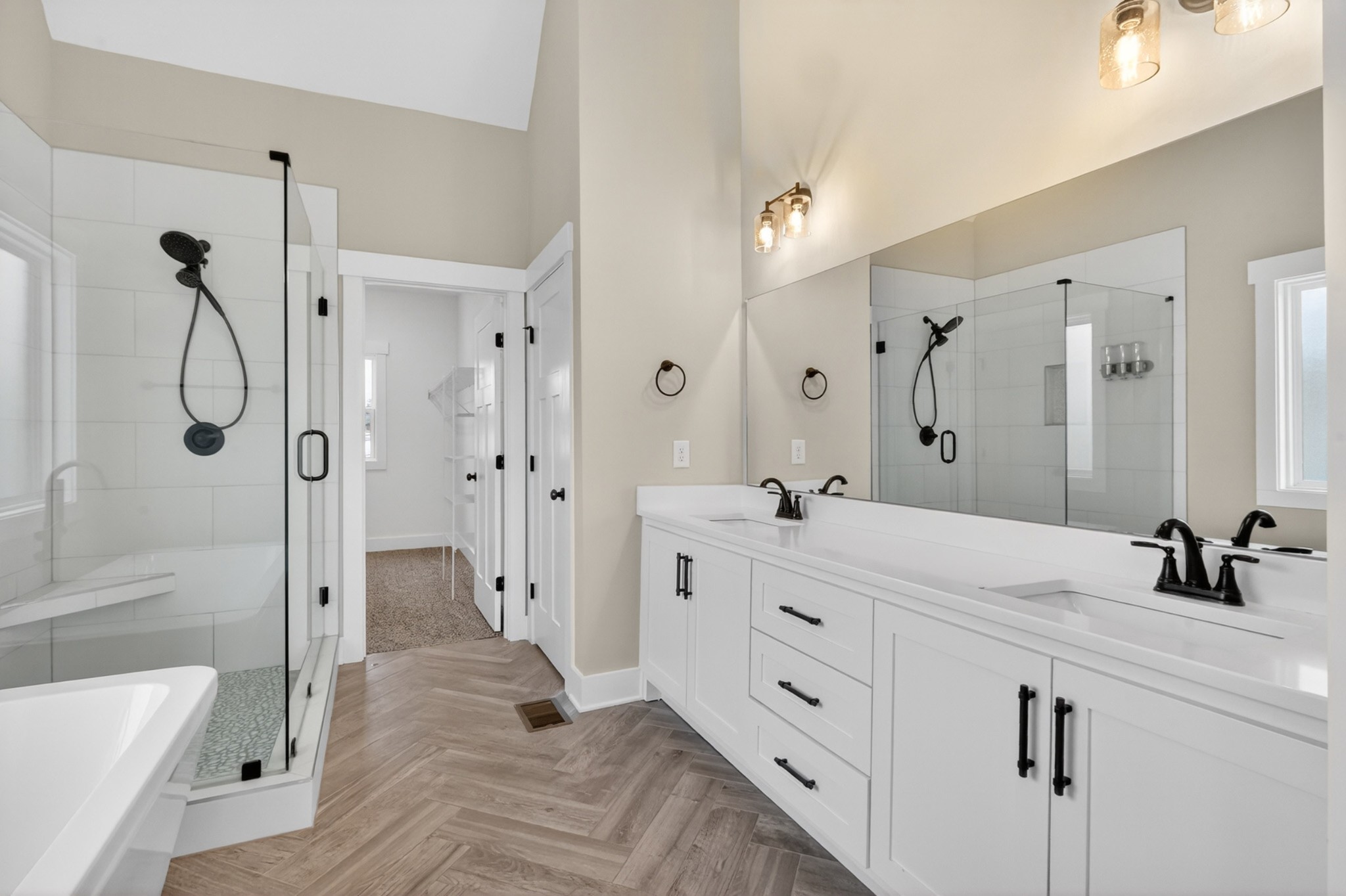 746 North Russell Street Portland, TN 37148 - Photo 21 of 45 a spacious bathroom with a double vanity sink a large mirror a shower and bathtub