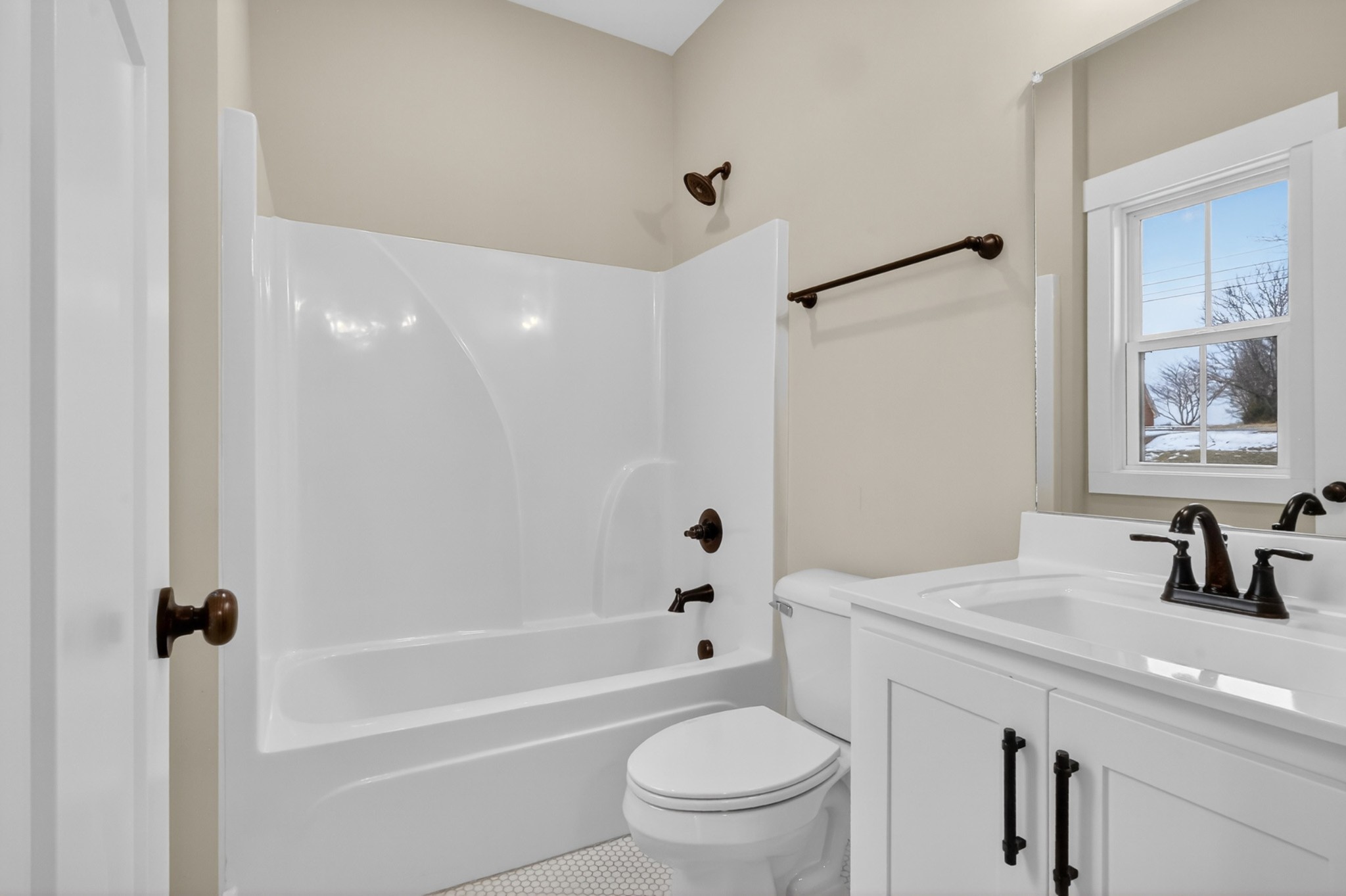 746 North Russell Street Portland, TN 37148 - Photo 26 of 45 a bathroom with a bathtub shower sink vanity mirror and toilet