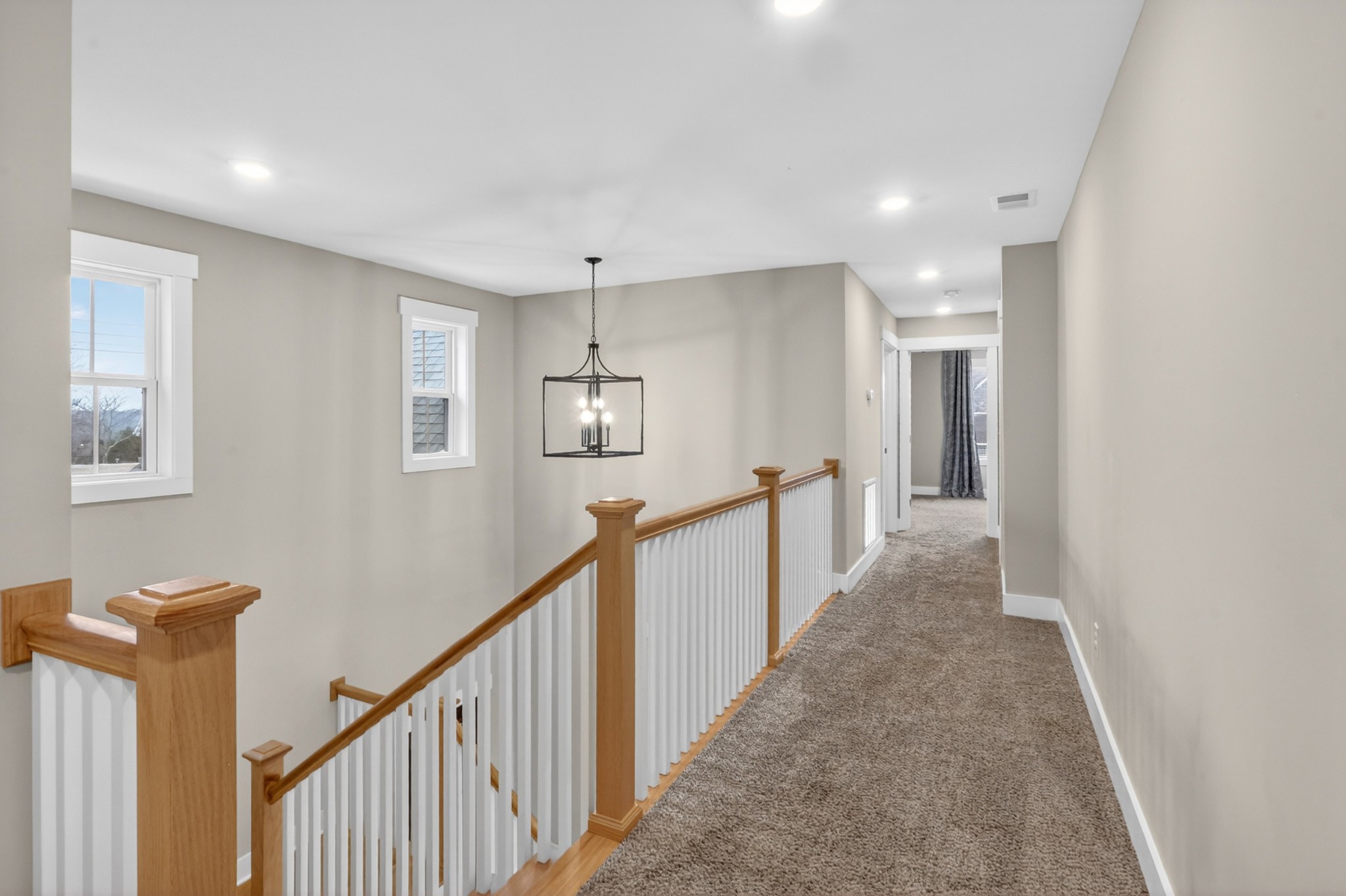 746 North Russell Street Portland, TN 37148 - Photo 28 of 45 a view of a hallway with wooden floor and staircase