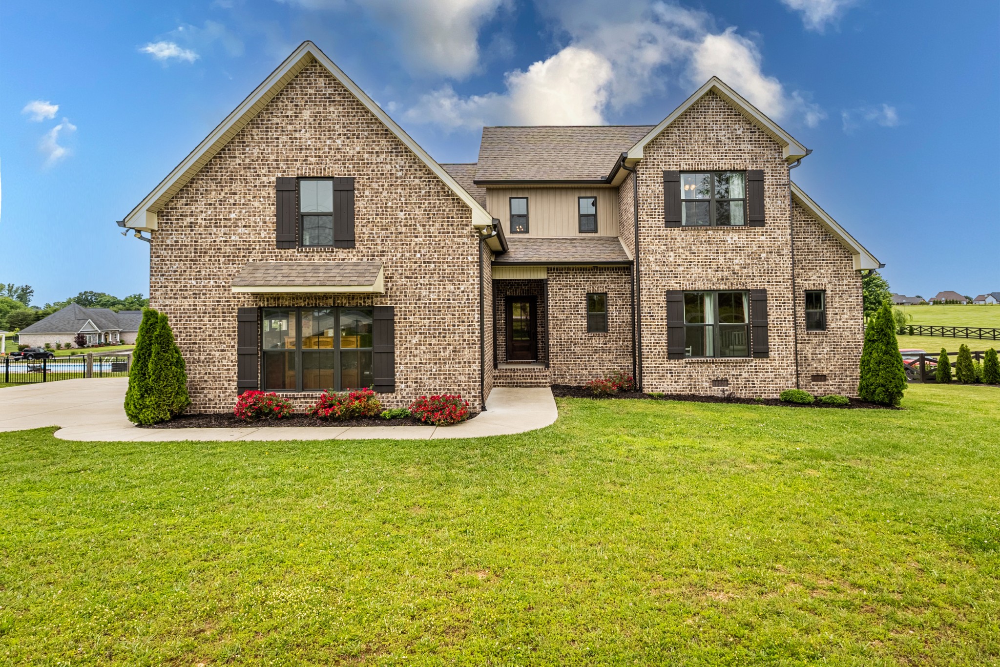 746 North Russell Street Portland, TN 37148 - Photo 3 of 45 a front view of a house with a yard and garage