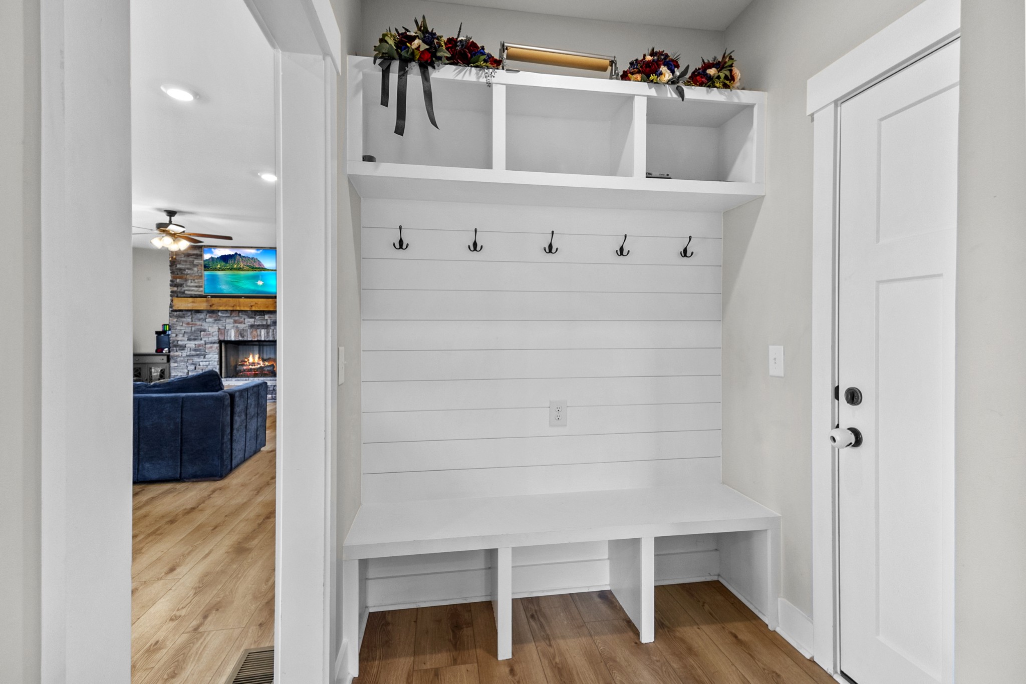 746 North Russell Street Portland, TN 37148 - Photo 40 of 45 a hallway with a white cabinets and wooden floor