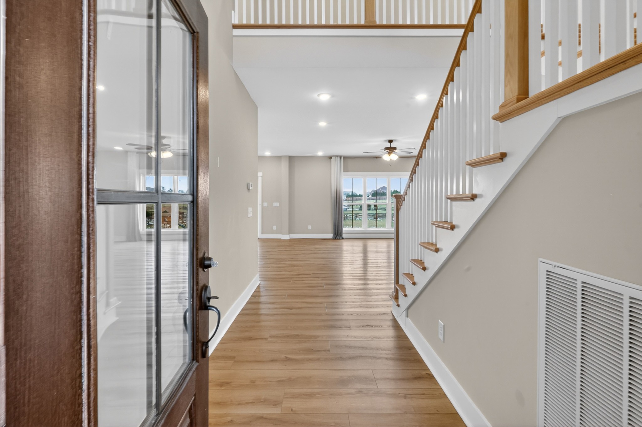746 North Russell Street Portland, TN 37148 - Photo 6 of 45 a view of a hallway with wooden floor and staircase