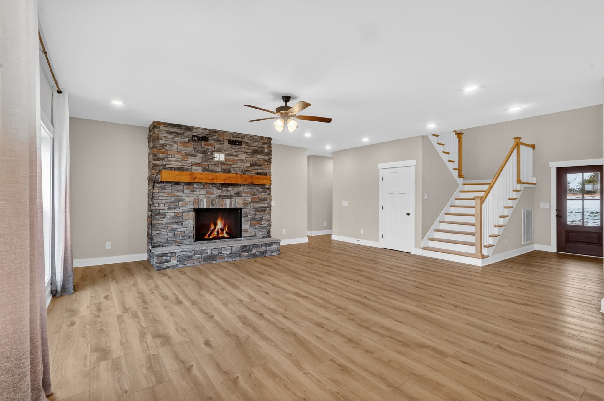 746 North Russell Street Portland, TN 37148 - Photo 9 of 45 a view of an empty room with wooden floor fireplace and a window
