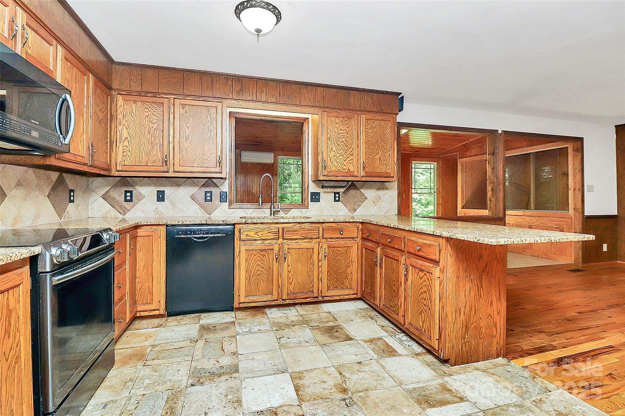 3311 Camden Road Marshville, NC 28103 - Photo 12 of 29 a kitchen with a sink stove and microwave