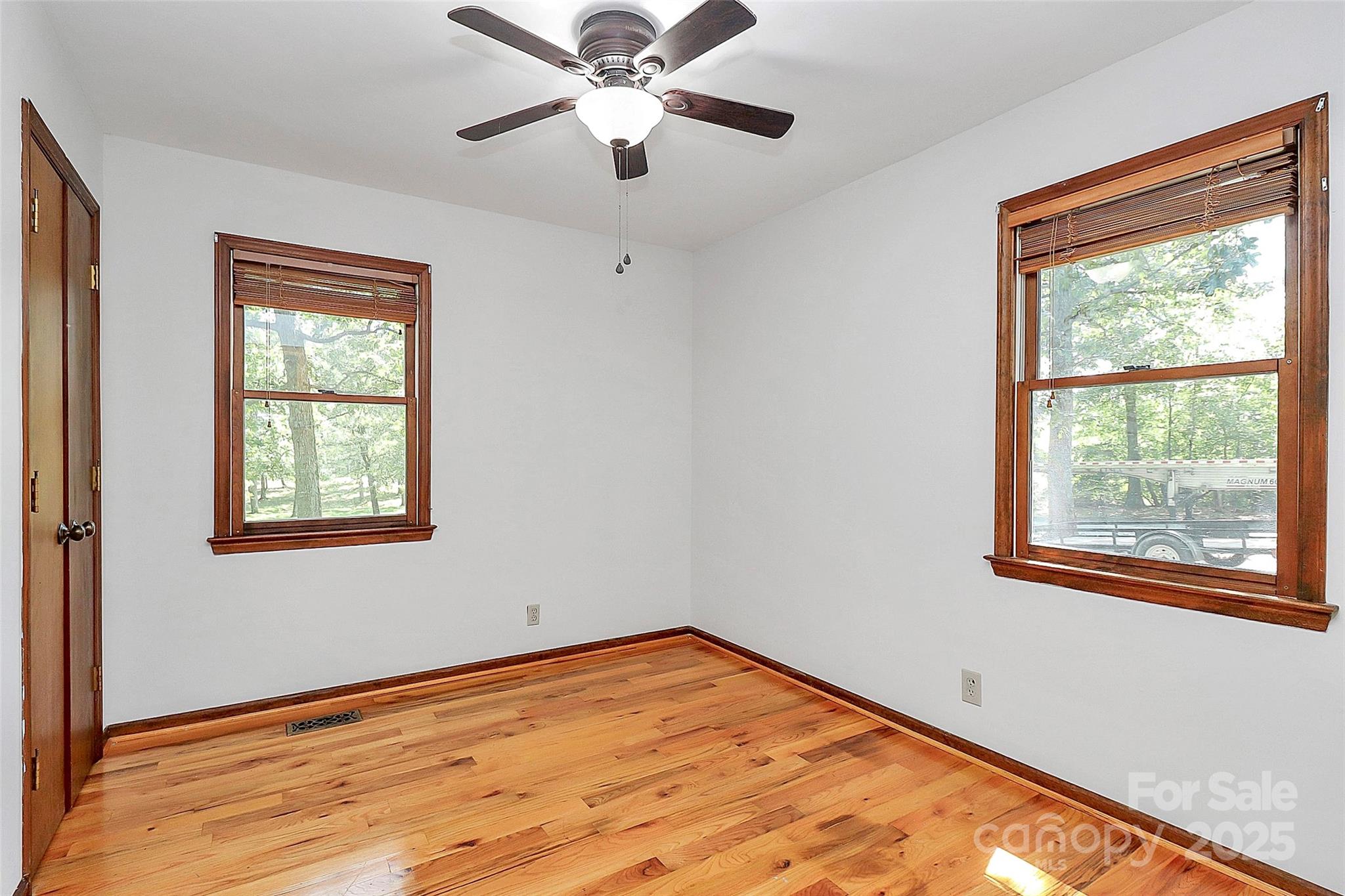 3311 Camden Road Marshville, NC 28103 - Photo 16 of 29 a view of an empty room with wooden floor and a window