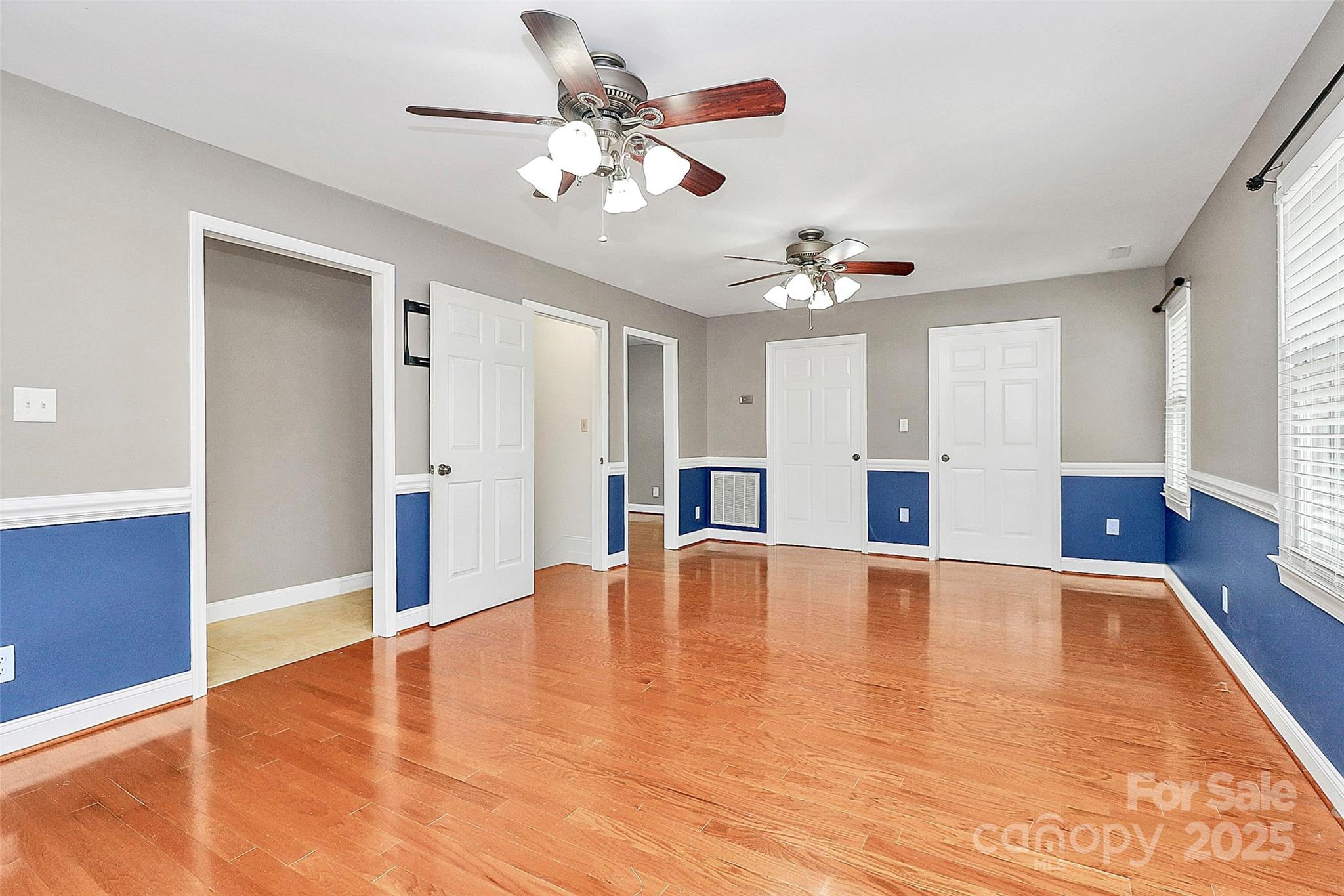3311 Camden Road Marshville, NC 28103 - Photo 21 of 29 a view of an empty room with a window and wooden floor