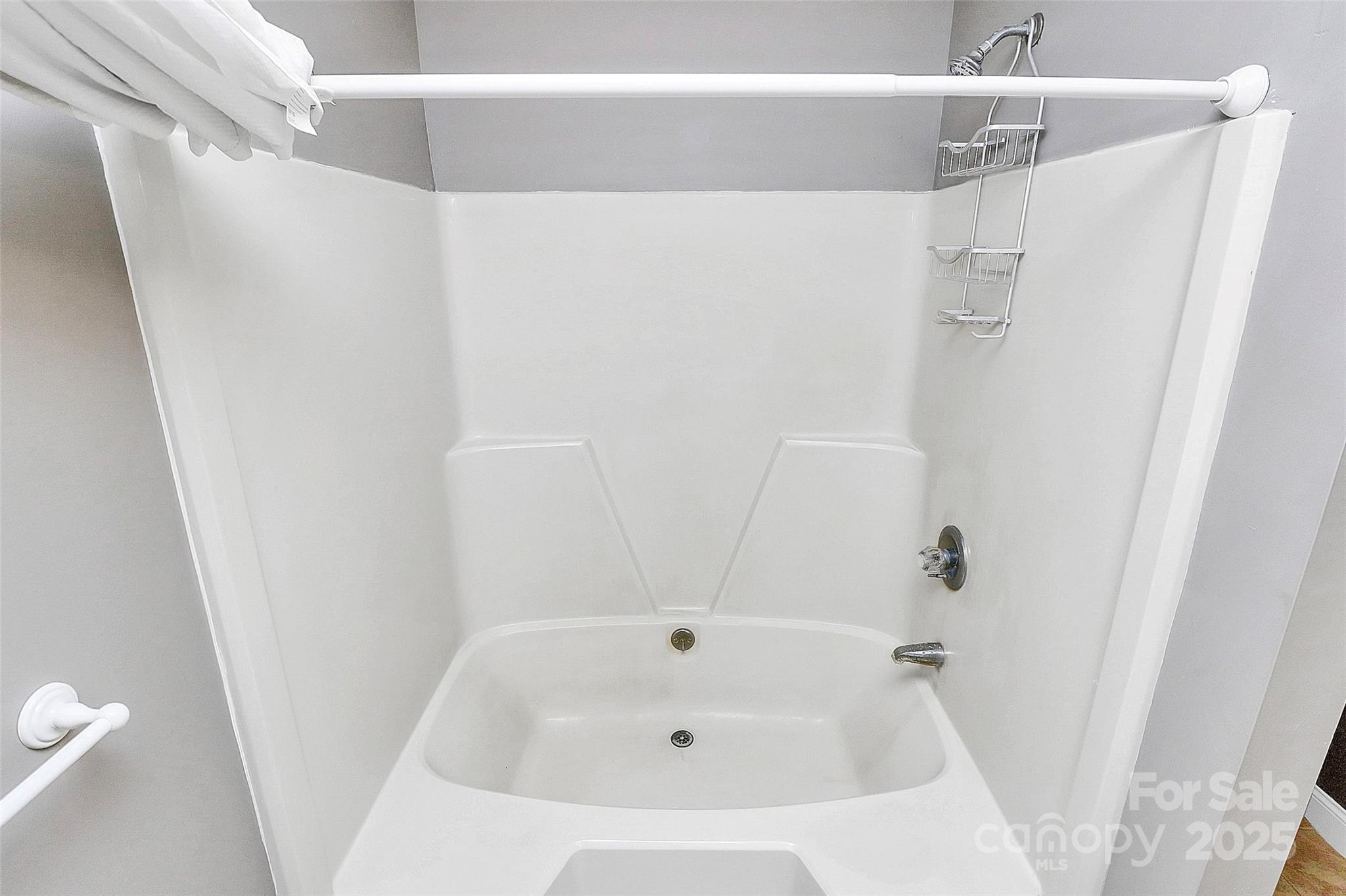 3311 Camden Road Marshville, NC 28103 - Photo 24 of 29 a bathroom with a white bath tub
