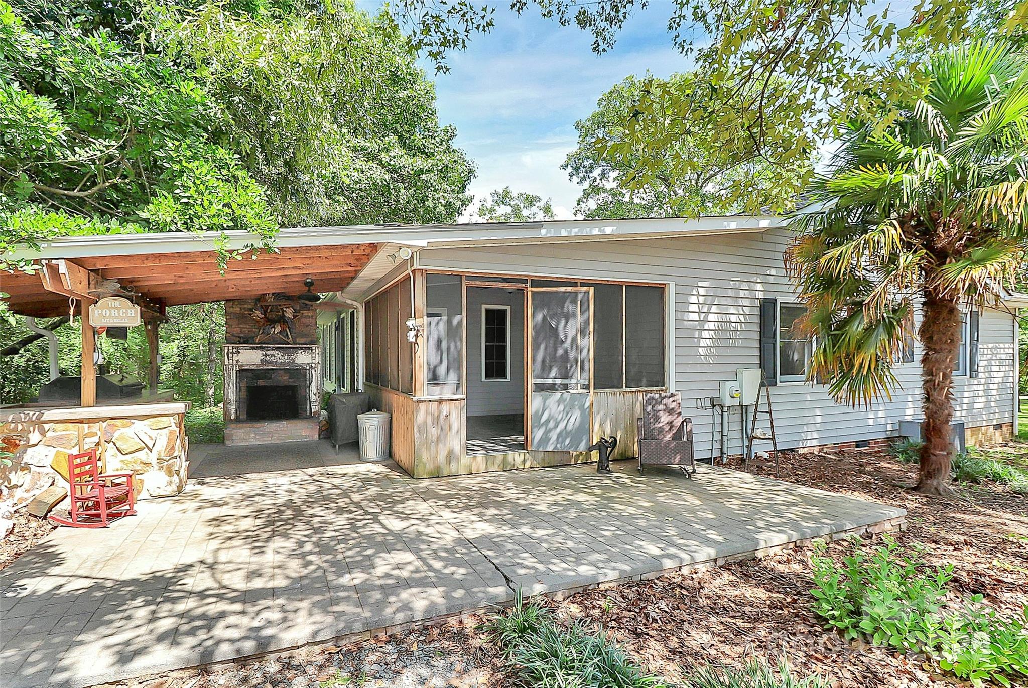 3311 Camden Road Marshville, NC 28103 - Photo 6 of 29 a view of a house with backyard porch and sitting area
