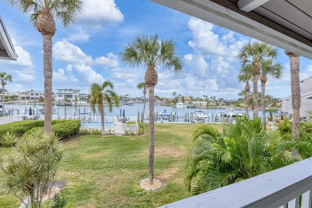 a living room with furniture a rug and white walls