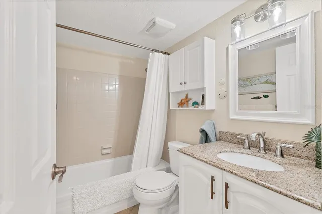 a bedroom with bed and balcony