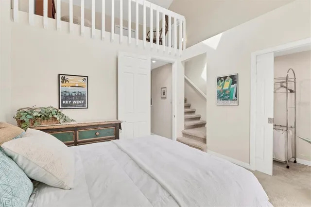 a balcony with table and chairs