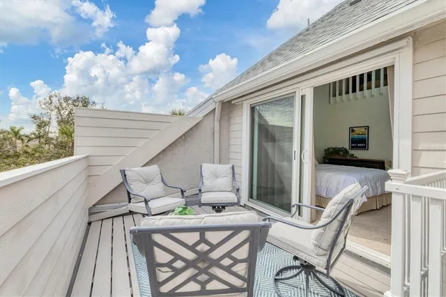 a view of staircase with a book shelf
