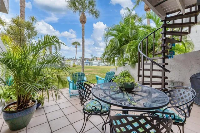 a front view of a building with a garden