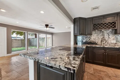 a kitchen with a stove and a sink