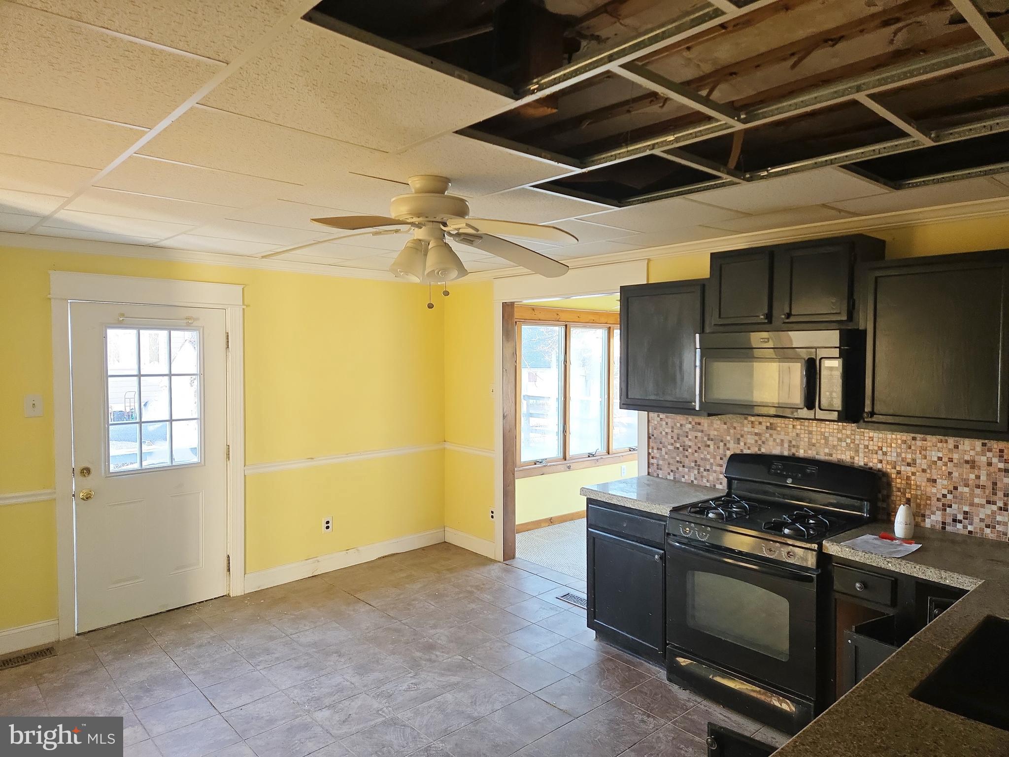 216 Broad Street Swedesboro, NJ 08085 - Photo 13 of 38 a kitchen with a stove and a refrigerator