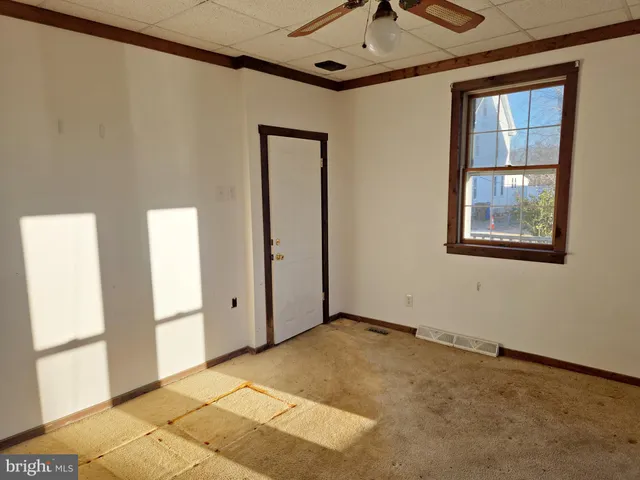 a view of an empty room with a windows