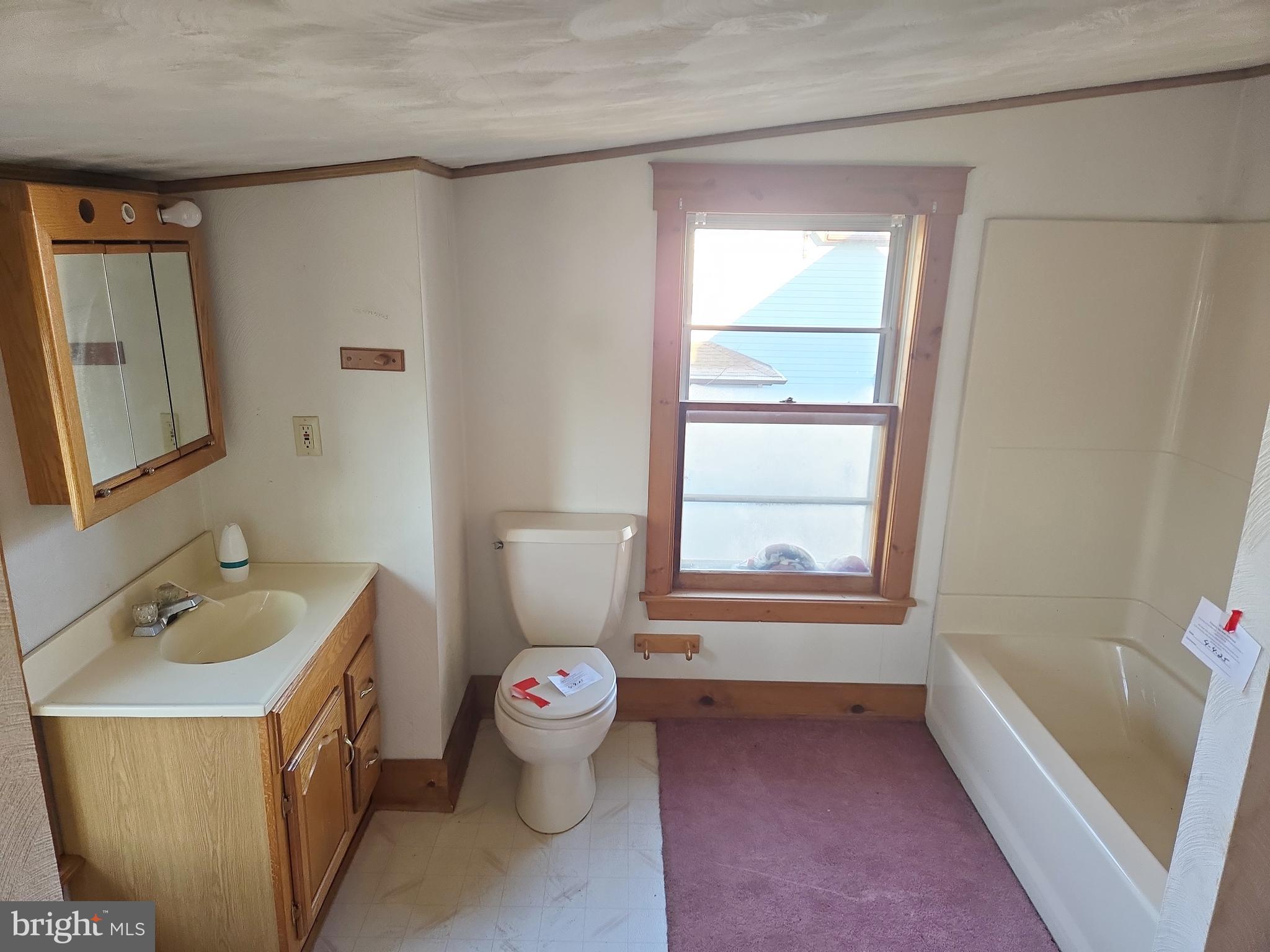 216 Broad Street Swedesboro, NJ 08085 - Photo 26 of 38 a bathroom with a sink toilet and tub