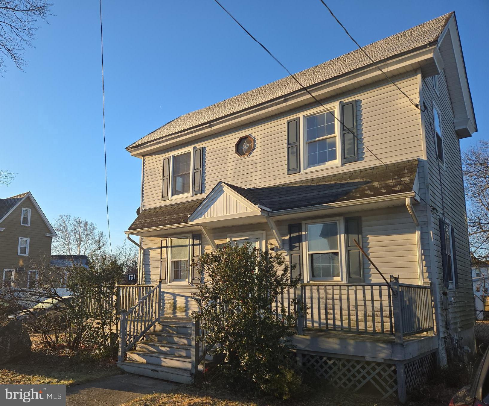 216 Broad Street Swedesboro, NJ 08085 - Photo 3 of 38 a front view of a house with a garden