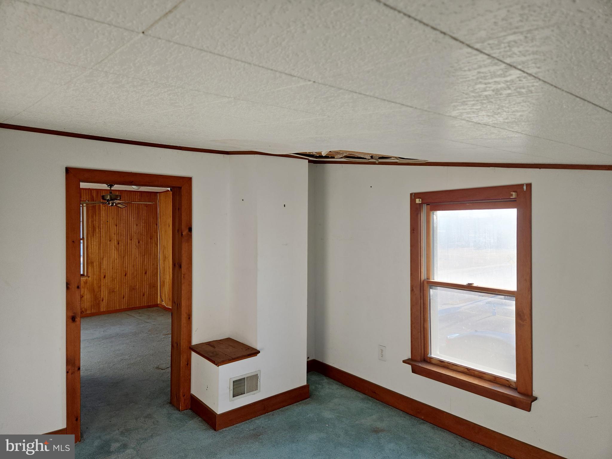 216 Broad Street Swedesboro, NJ 08085 - Photo 32 of 38 a living room with a bed and a window