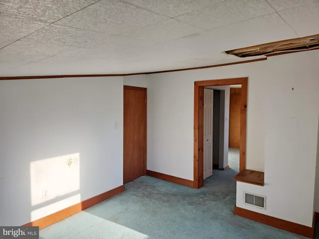 a view of a room with a storage and utility room