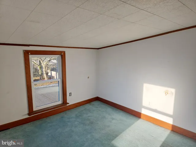 a view of a room with wooden walls