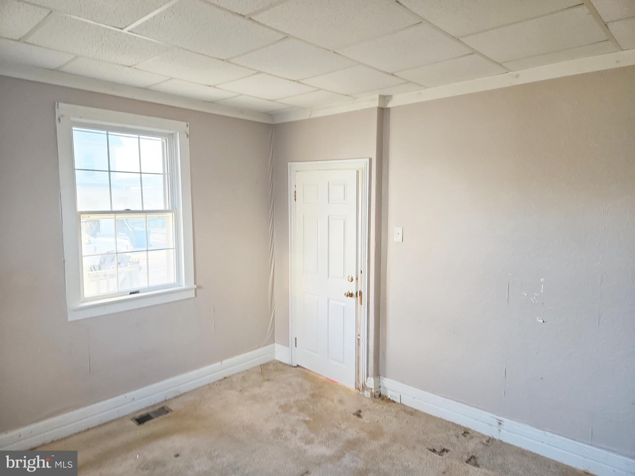216 Broad Street Swedesboro, NJ 08085 - Photo 10 of 38 an empty room with windows