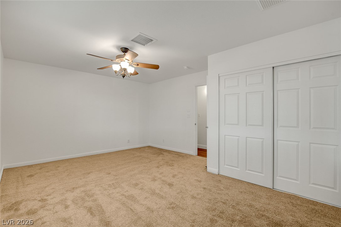 1810 Pinto Road Henderson, NV 89002 - Photo 37 of 53 Well-lit and ready for personalization, this bedroom offers ample space with convenient closet access.