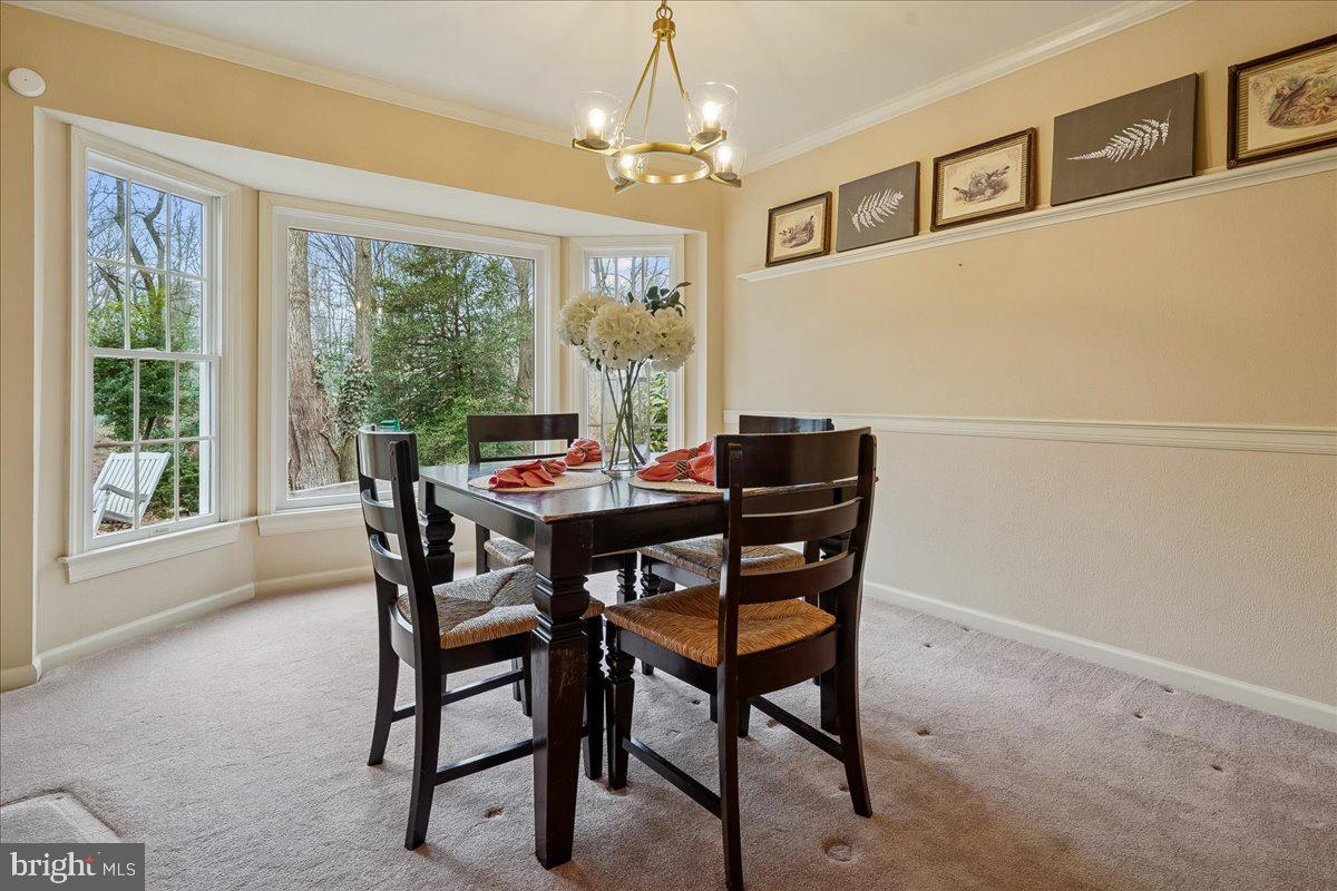 15510 Ridgecrest Drive Dumfries, VA 22025 - Photo 12 of 48 a view of a dining room with furniture window and outside view