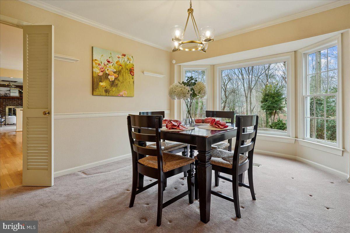 15510 Ridgecrest Drive Dumfries, VA 22025 - Photo 13 of 48 a view of a dining room with furniture window and outside view
