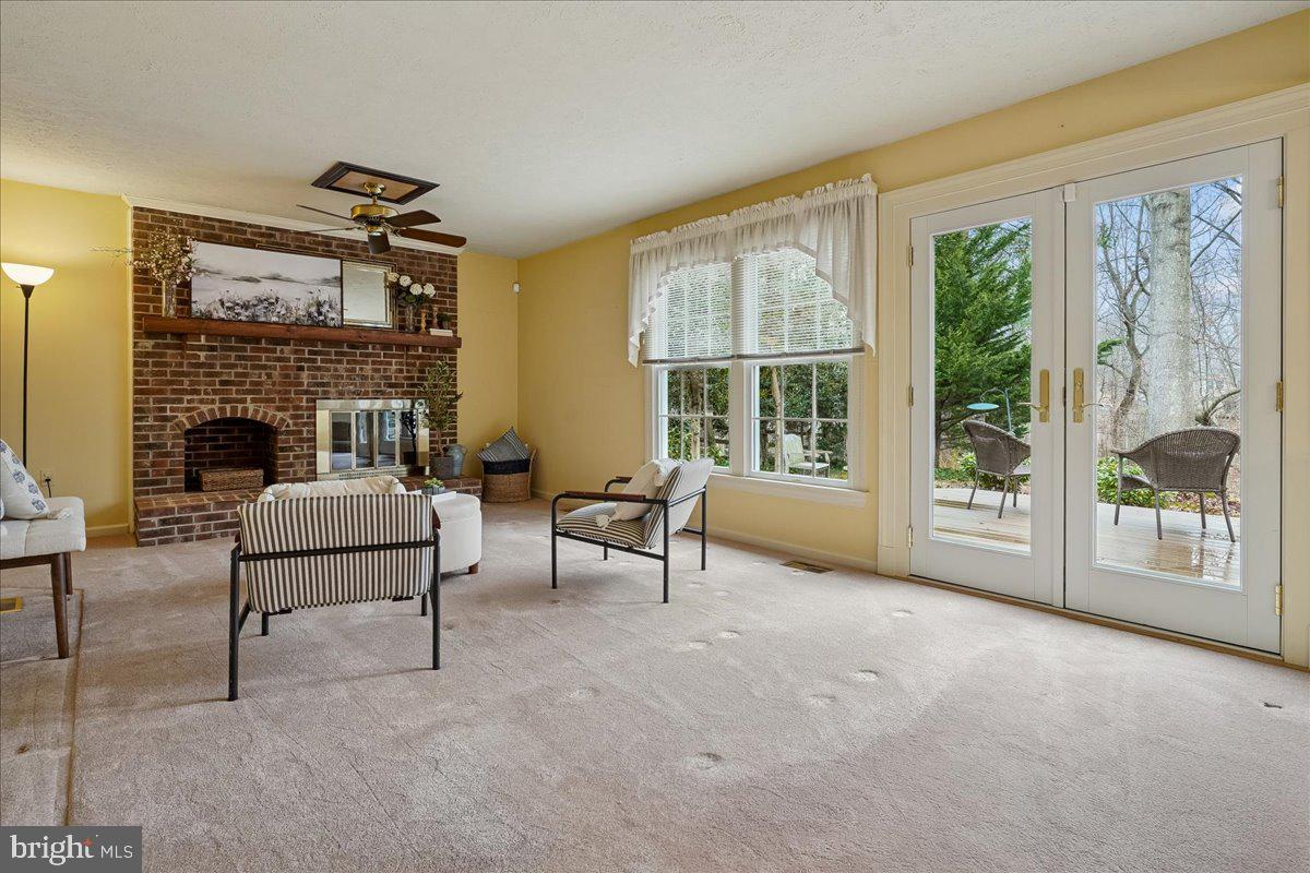 15510 Ridgecrest Drive Dumfries, VA 22025 - Photo 20 of 48 a living room with furniture and a fireplace