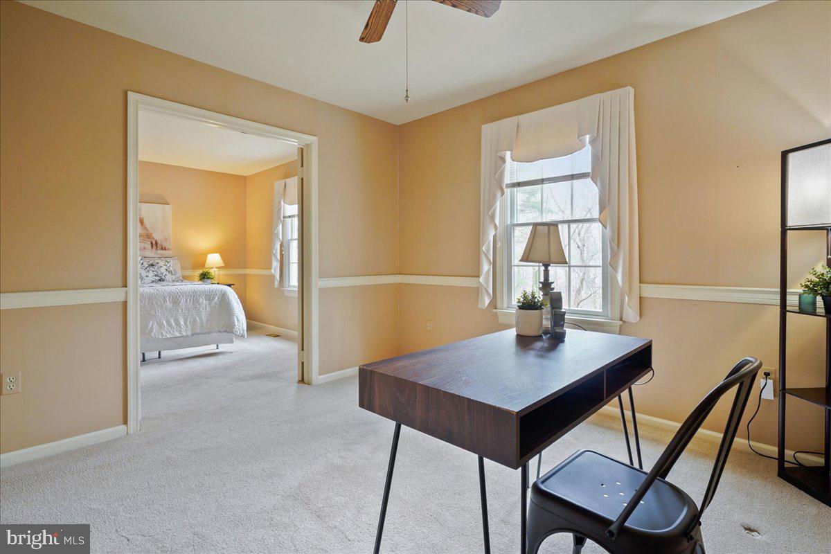15510 Ridgecrest Drive Dumfries, VA 22025 - Photo 33 of 48 a workspace with furniture and window